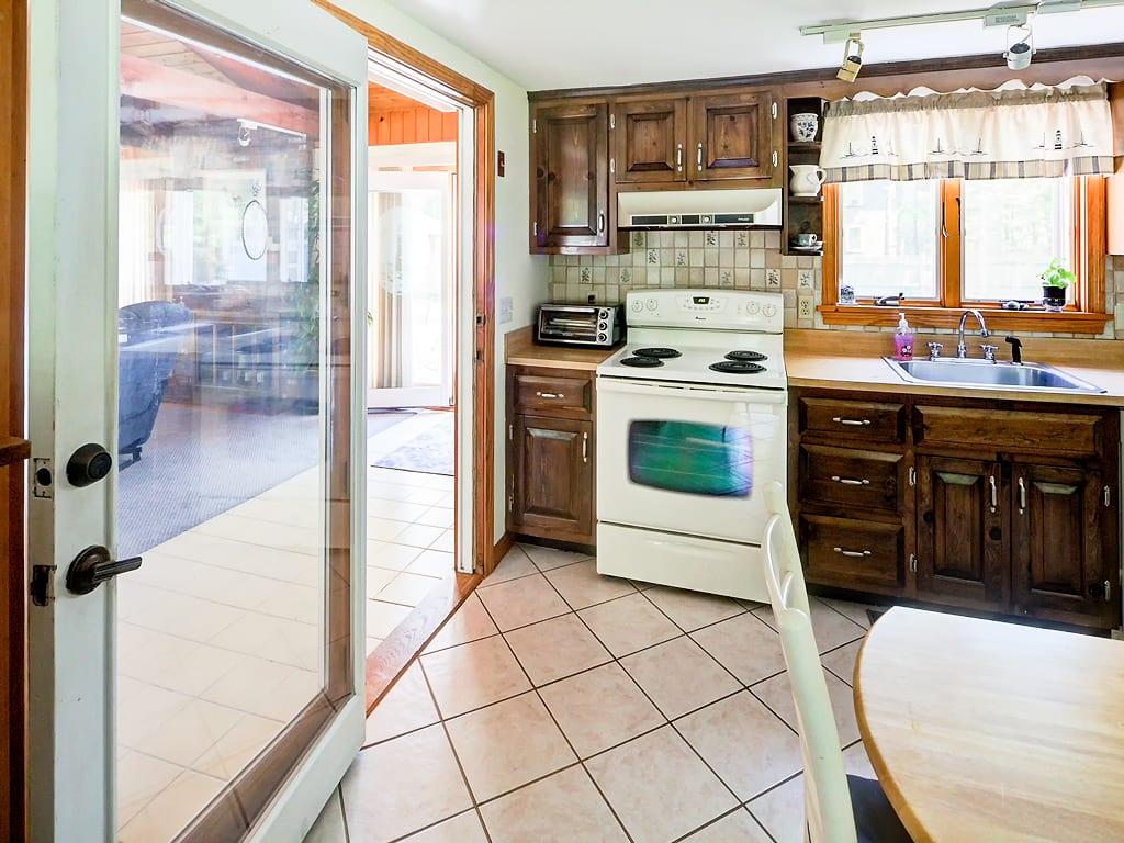 281 South Sandwich Road Mashpee, MA 02649 - Photo 9 of 25 a kitchen with stainless steel appliances a stove a sink and a refrigerator