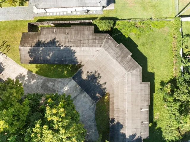 a backyard of a house with a table and chairs