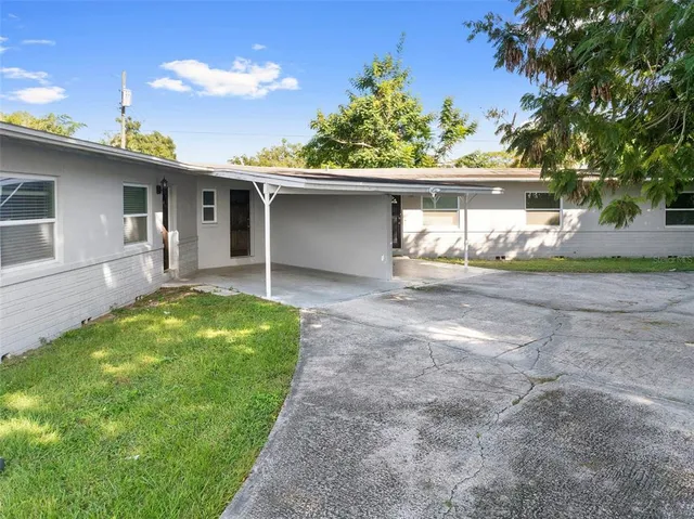a bedroom with a bed and a refrigerator