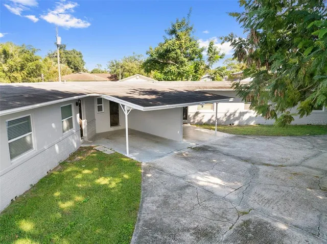 a kitchen with stainless steel appliances granite countertop a refrigerator and a stove