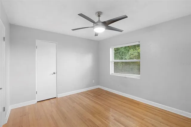 a view of an empty room with a window