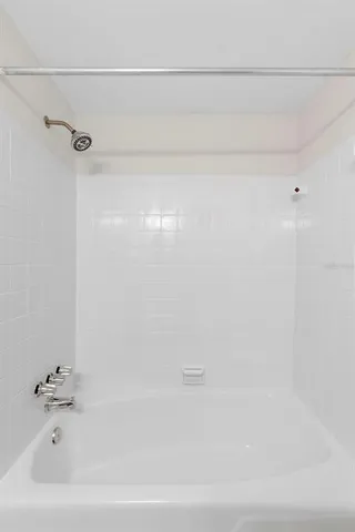 a bathroom with a toilet a sink a vanity and mirror