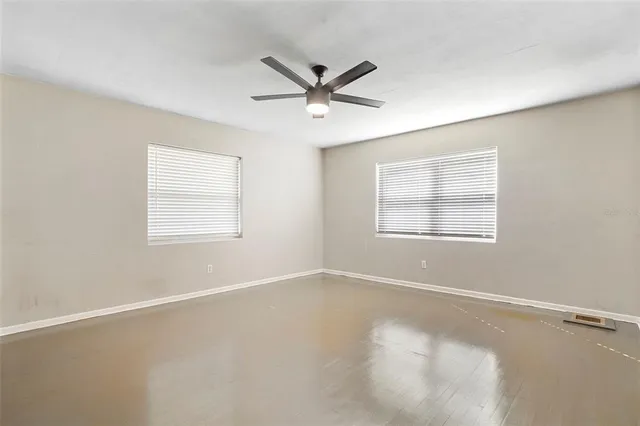 a kitchen with stainless steel appliances granite countertop a sink a stove and refrigerator