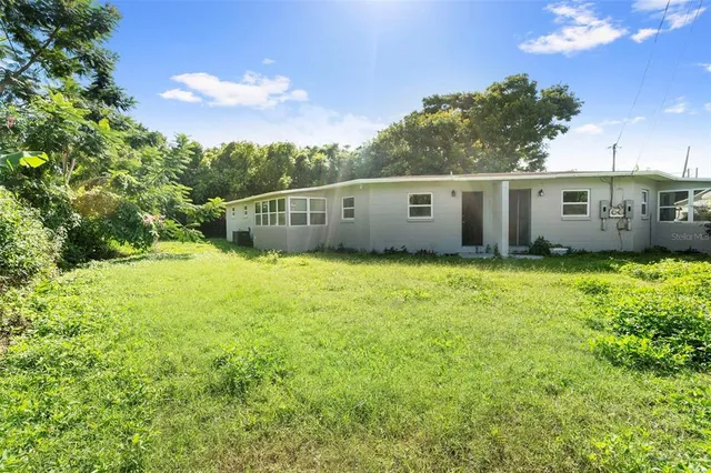 a view of a pathway with a yard
