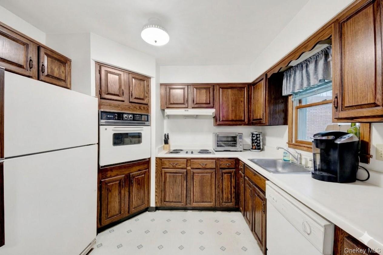 17 Last Road Middletown, NY 10941 - Photo 7 of 23 a kitchen with stainless steel appliances a sink stove refrigerator and cabinets