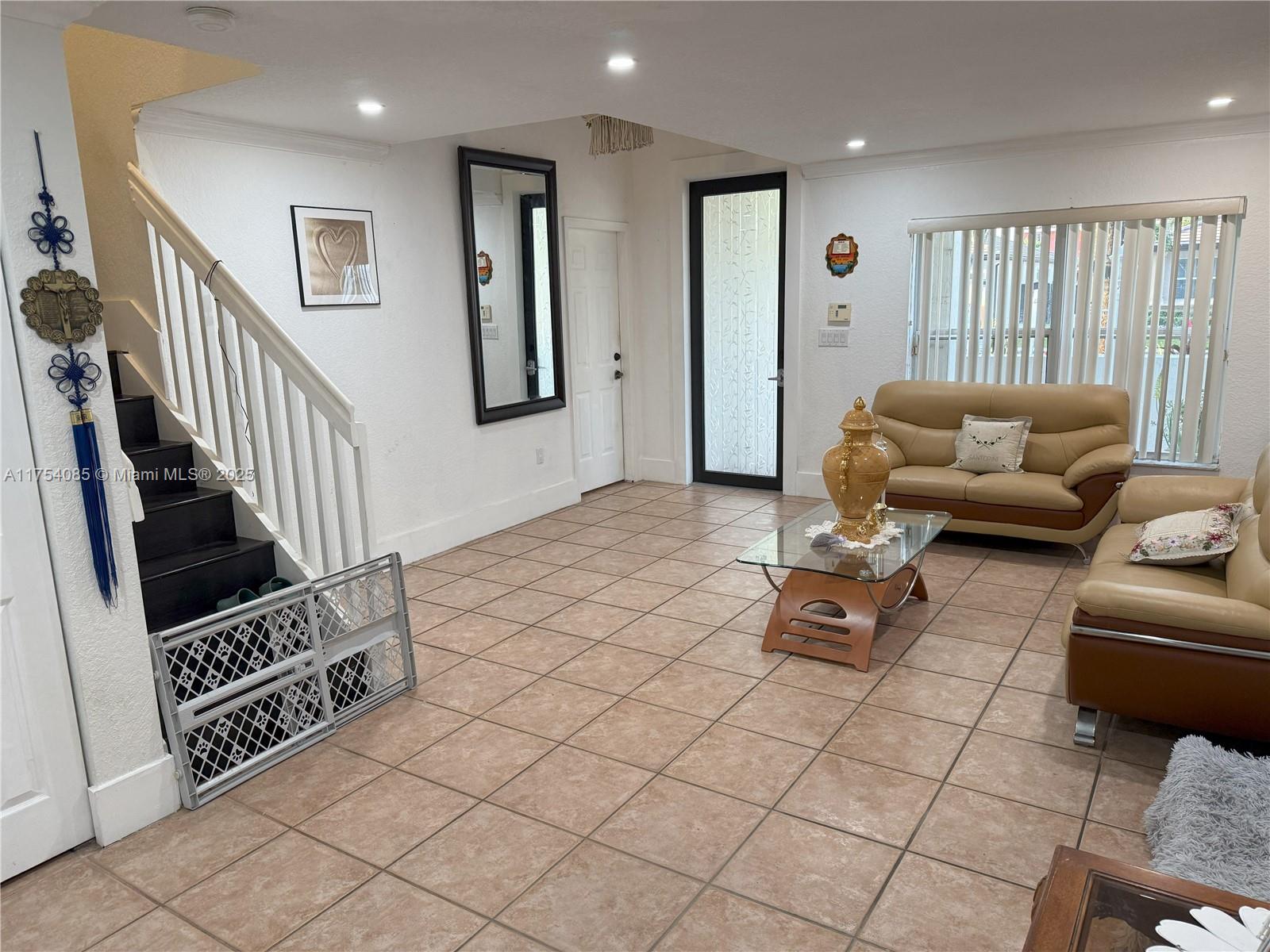 16618 Southwest 68th Terrace Miami, FL 33193 - Photo 11 of 34 a living room with furniture and wooden floor