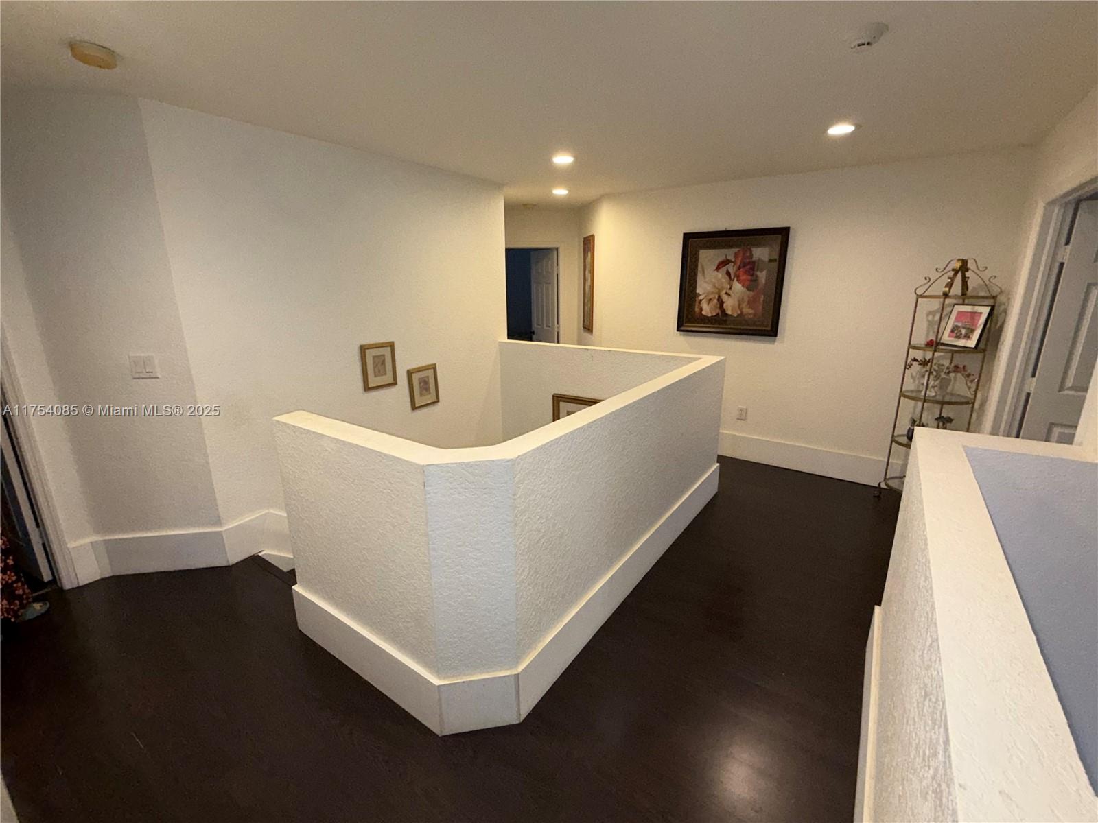 16618 Southwest 68th Terrace Miami, FL 33193 - Photo 14 of 34 a white room with wooden floor