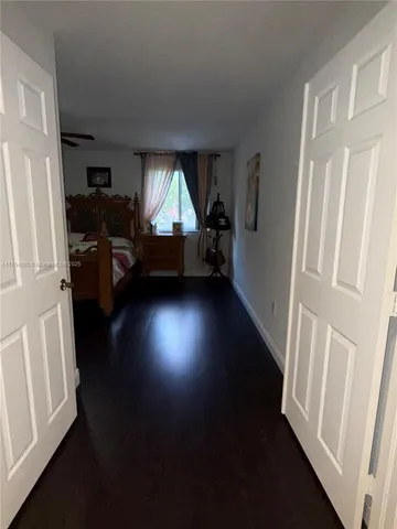 a view of a livingroom with furniture and a window