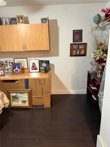 a view of workspace with furniture and book shelf