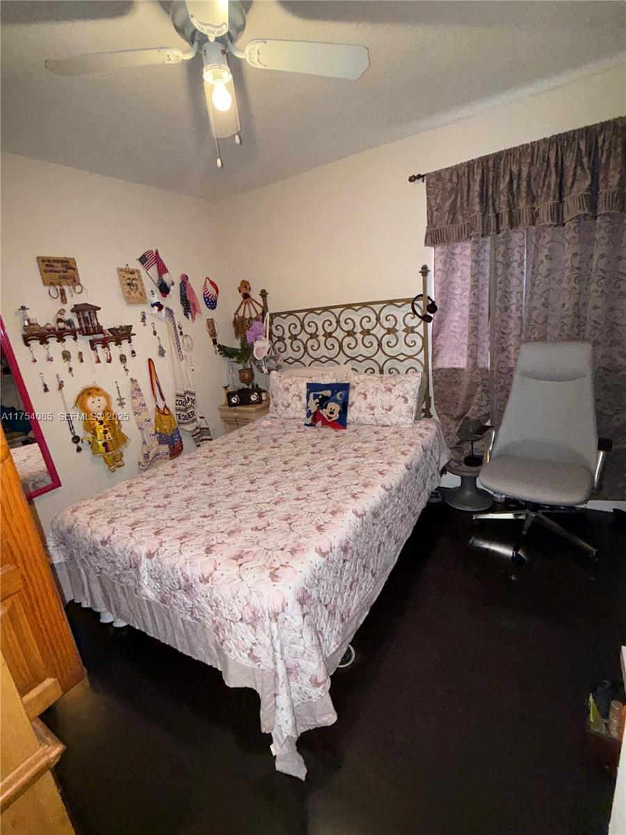 16618 Southwest 68th Terrace Miami, FL 33193 - Photo 27 of 34 a bedroom with bed and window