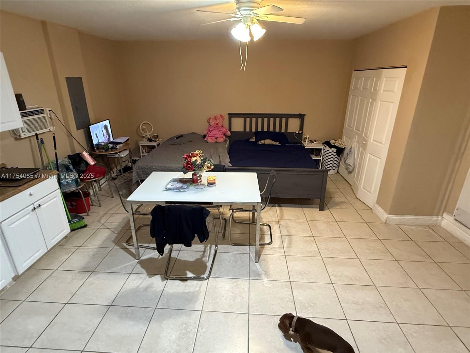 16618 Southwest 68th Terrace Miami, FL 33193 - Photo 34 of 34 a living room with furniture and a flat screen tv