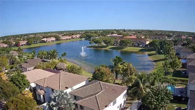 an aerial view of a house with a lake view