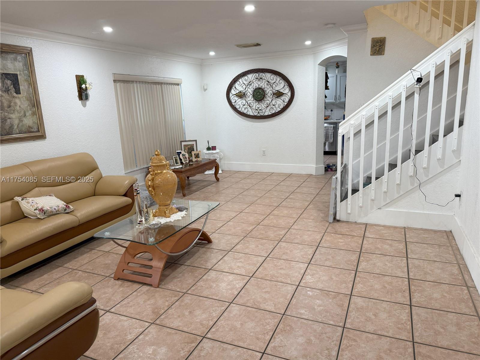 16618 Southwest 68th Terrace Miami, FL 33193 - Photo 9 of 34 a view of a livingroom with furniture and a rug