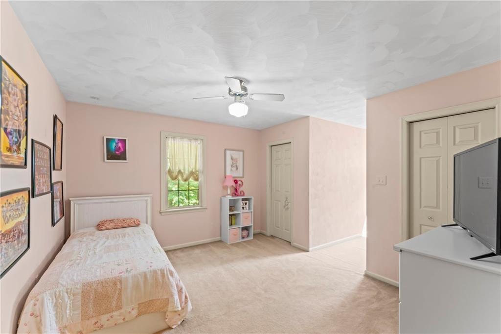 322 South Locust Road Acme, PA 15610 - Photo 24 of 39 a bedroom with a bed and a flat screen tv