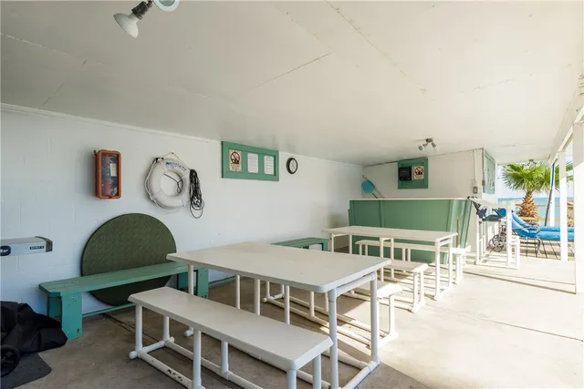 a view of a swimming pool with chairs