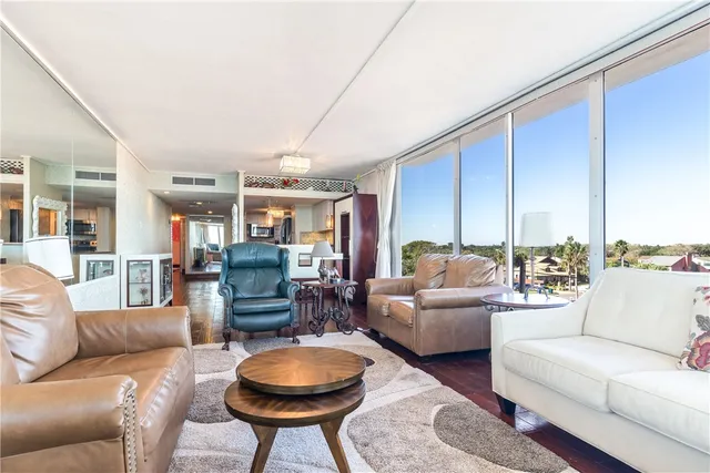 a view of a dining room with furniture wooden floor and chandelier