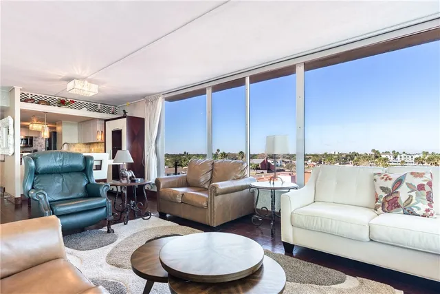 a kitchen with stainless steel appliances a refrigerator and wooden floor