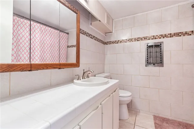 a bed room with a bed and a lamp