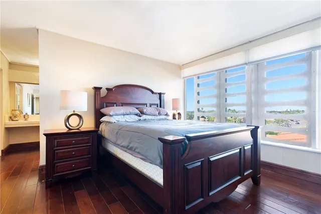 a spacious bathroom with a double vanity sink a mirror and a bathtub