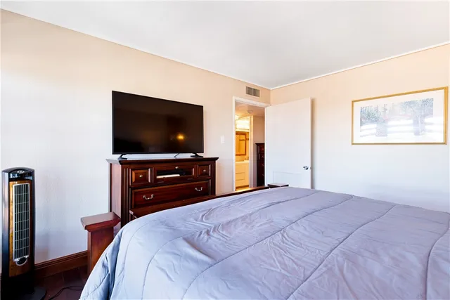 a bathroom with a sink vanity mirror and toilet