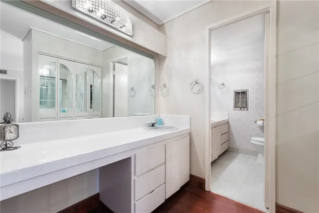 a living room with furniture and view of kitchen