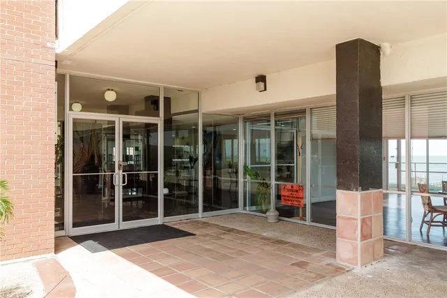a view of a balcony with chairs