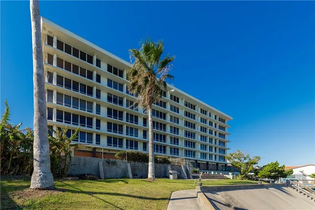 a view of a swimming pool and an outdoor seating