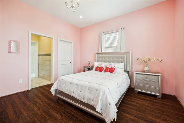 a bedroom with a bed and a dresser