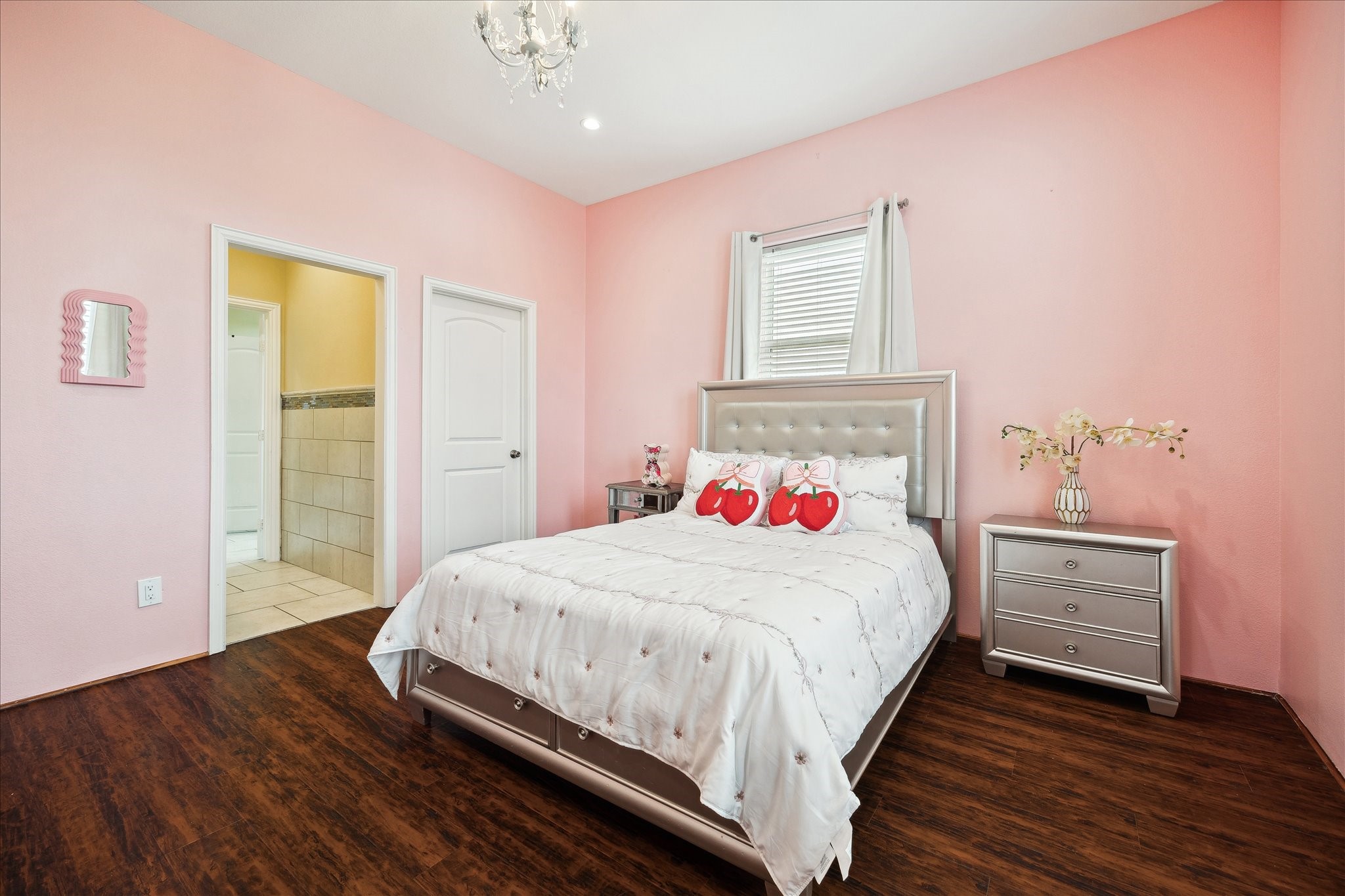 8917 Hawk Road Pearland, TX 77584 - Photo 17 of 33 a bedroom with a bed and a dresser