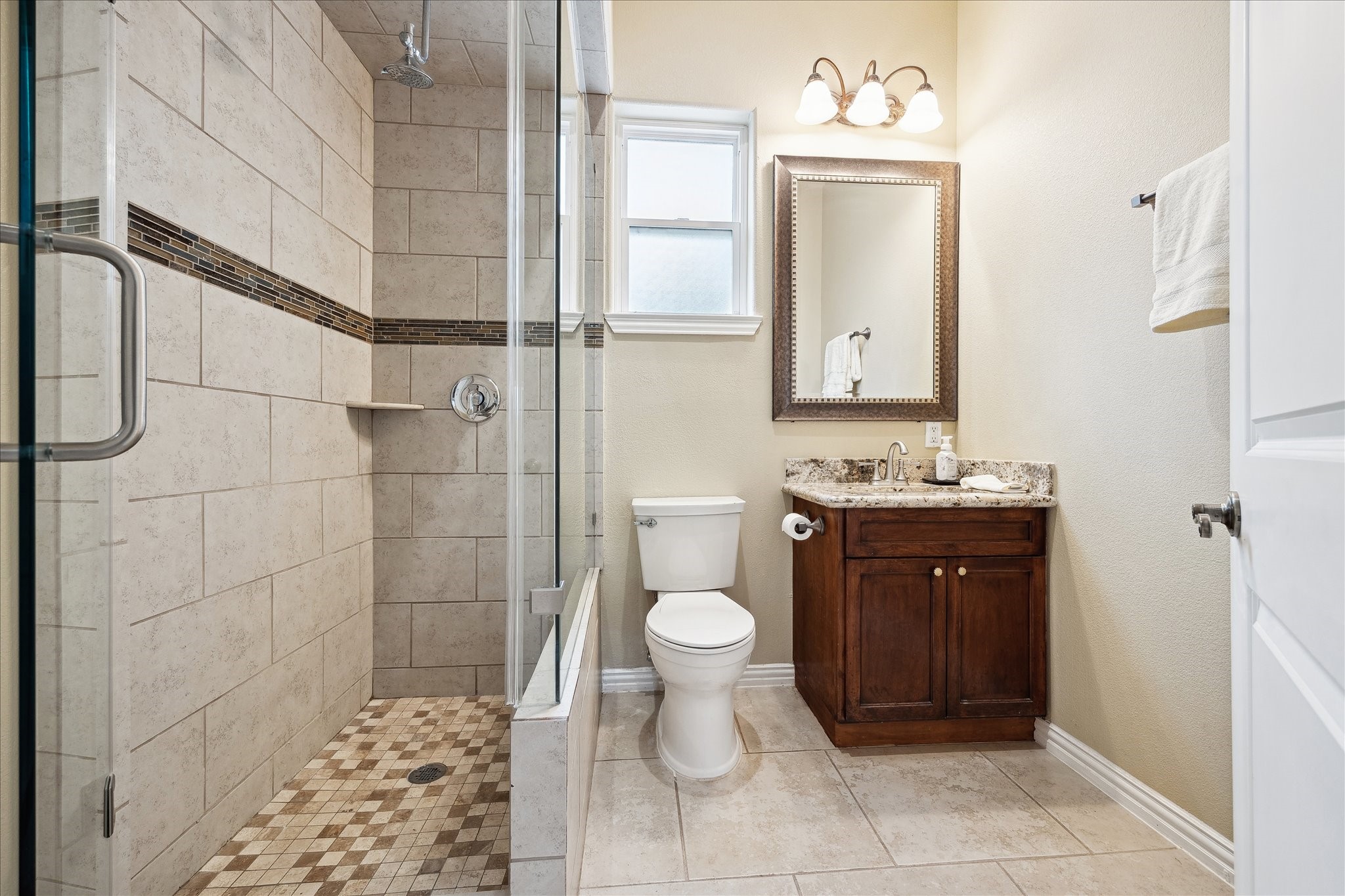8917 Hawk Road Pearland, TX 77584 - Photo 19 of 33 a bathroom with a sink a toilet and shower