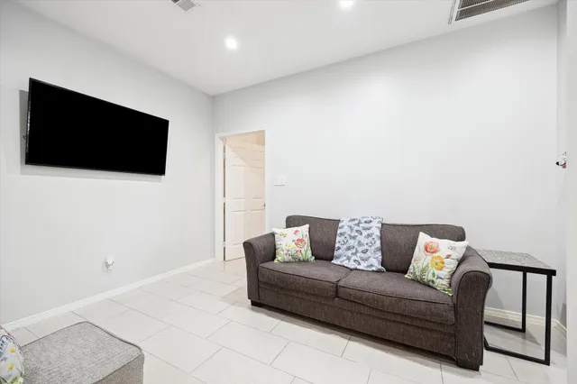 a living room with a couch and a flat screen tv