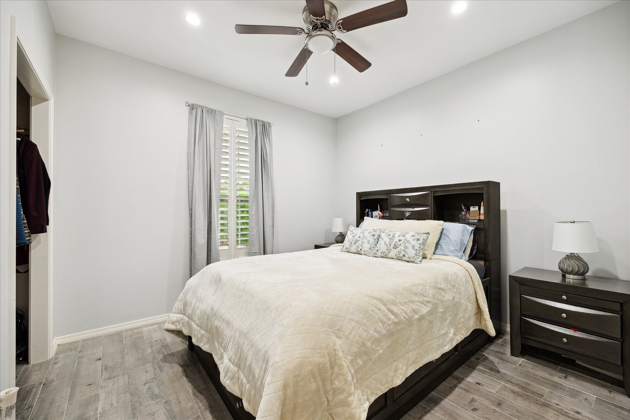 8917 Hawk Road Pearland, TX 77584 - Photo 26 of 33 a bedroom with a bed and a chandelier