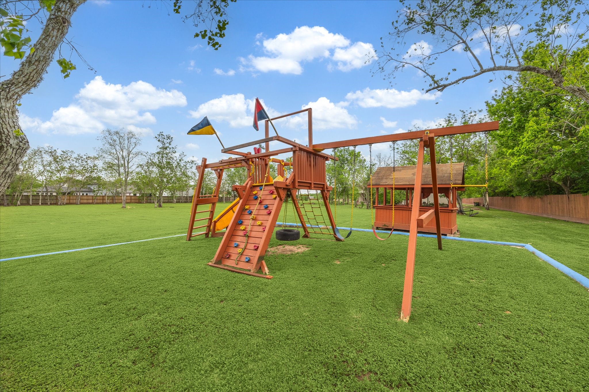 8917 Hawk Road Pearland, TX 77584 - Photo 32 of 33 a view of a playground with a slide