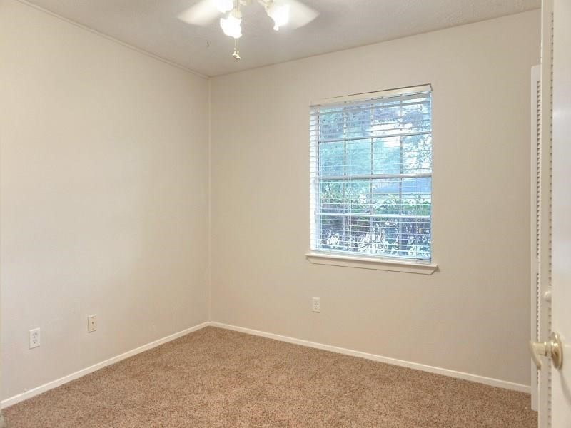 16210 Cypress Point Drive Cypress, TX 77429 - Photo 8 of 10 an empty room with a window