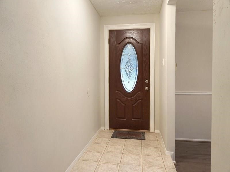 16210 Cypress Point Drive Cypress, TX 77429 - Photo 10 of 10 a view of a hallway with washer and dryer