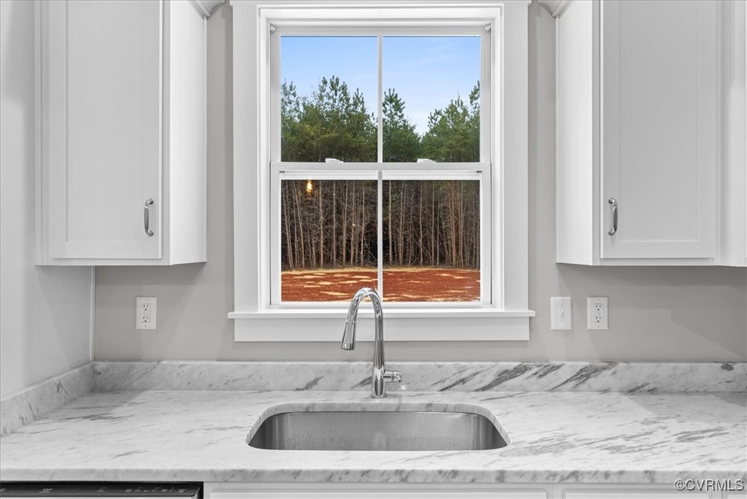 292 Lunenburg County Road Keysville, VA 23947 - Photo 18 of 39 Kitchen with dishwashing machine, sink, light ston