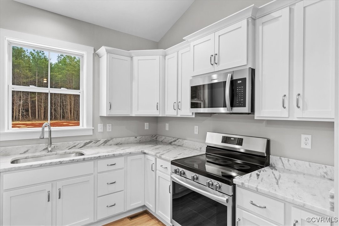 292 Lunenburg County Road Keysville, VA 23947 - Photo 19 of 39 Kitchen featuring stainless steel appliances, loft