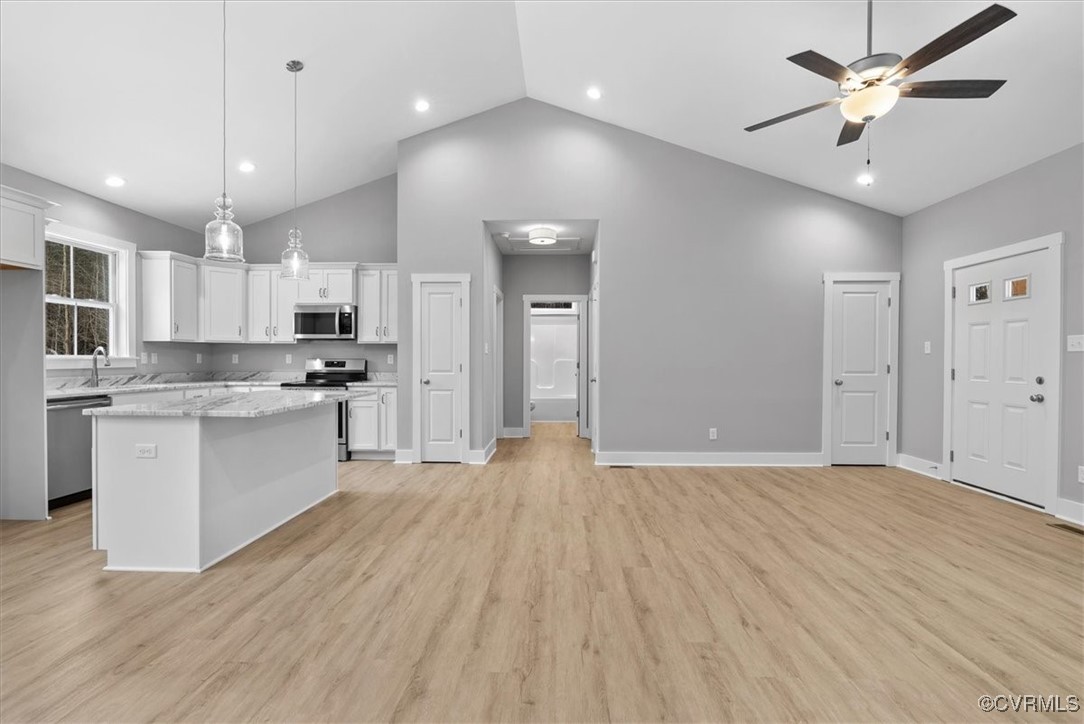 292 Lunenburg County Road Keysville, VA 23947 - Photo 30 of 39 Kitchen with pendant lighting, white cabinets, app