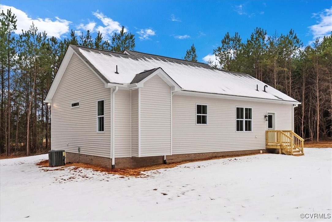 292 Lunenburg County Road Keysville, VA 23947 - Photo 5 of 39 View of snow covered exterior with central AC unit
