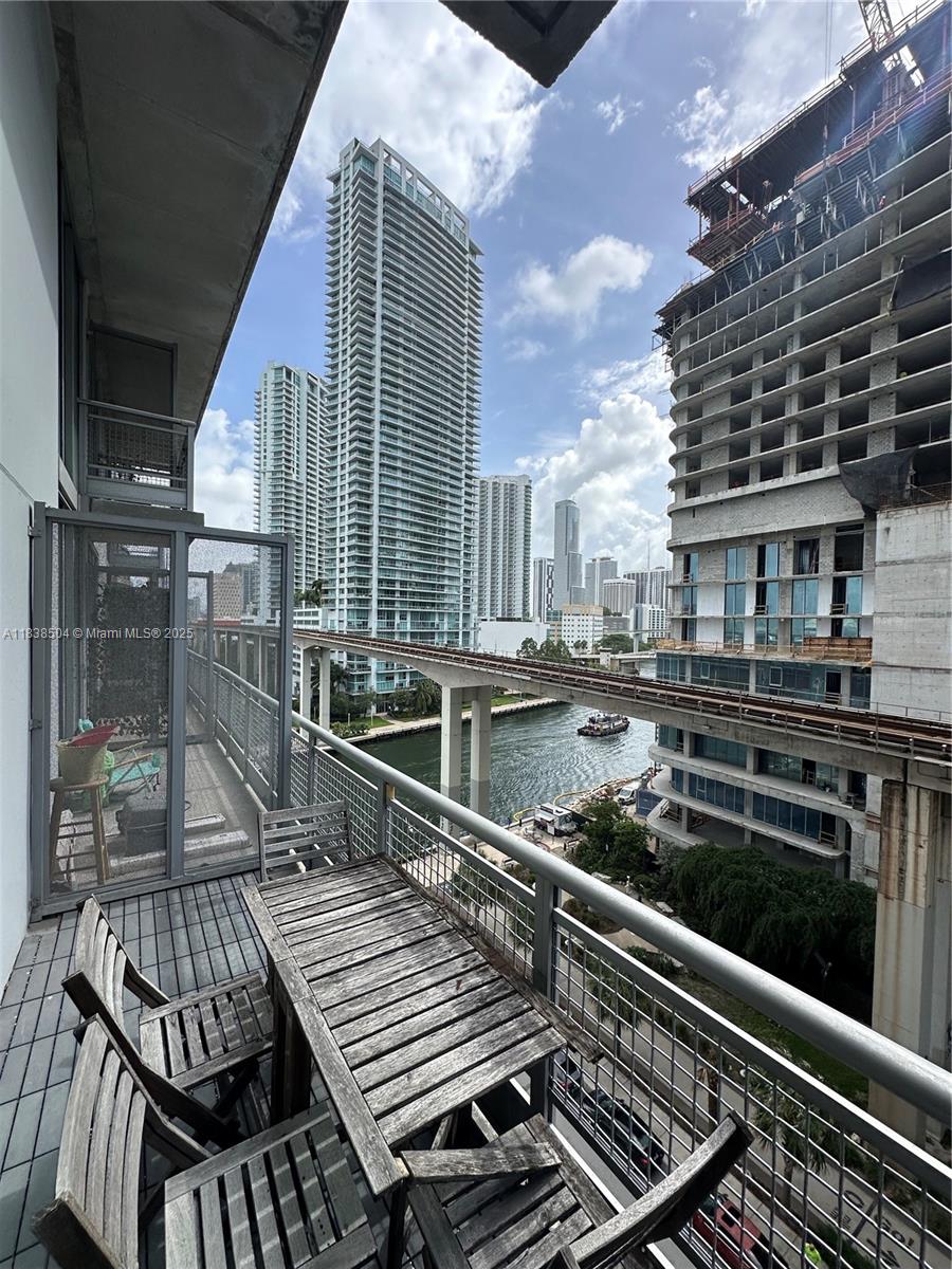 a view of a balcony with wooden floor