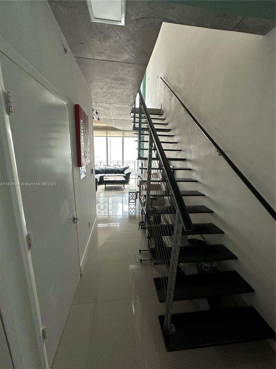 690 Southwest 1st Court, Unit 1010 Miami, FL 33130 - Photo 6 of 11 a view of entryway and hall with wooden floor