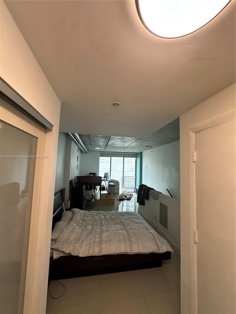 690 Southwest 1st Court, Unit 1010 Miami, FL 33130 - Photo 8 of 11 a view of kitchen with furniture and window