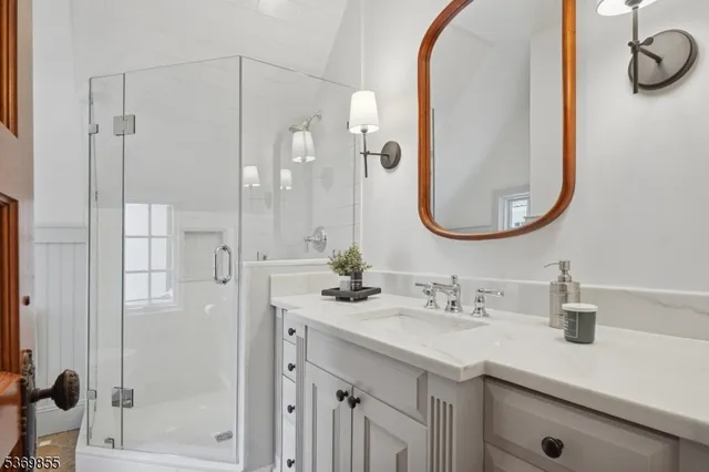 a front view of a house with yard and green space