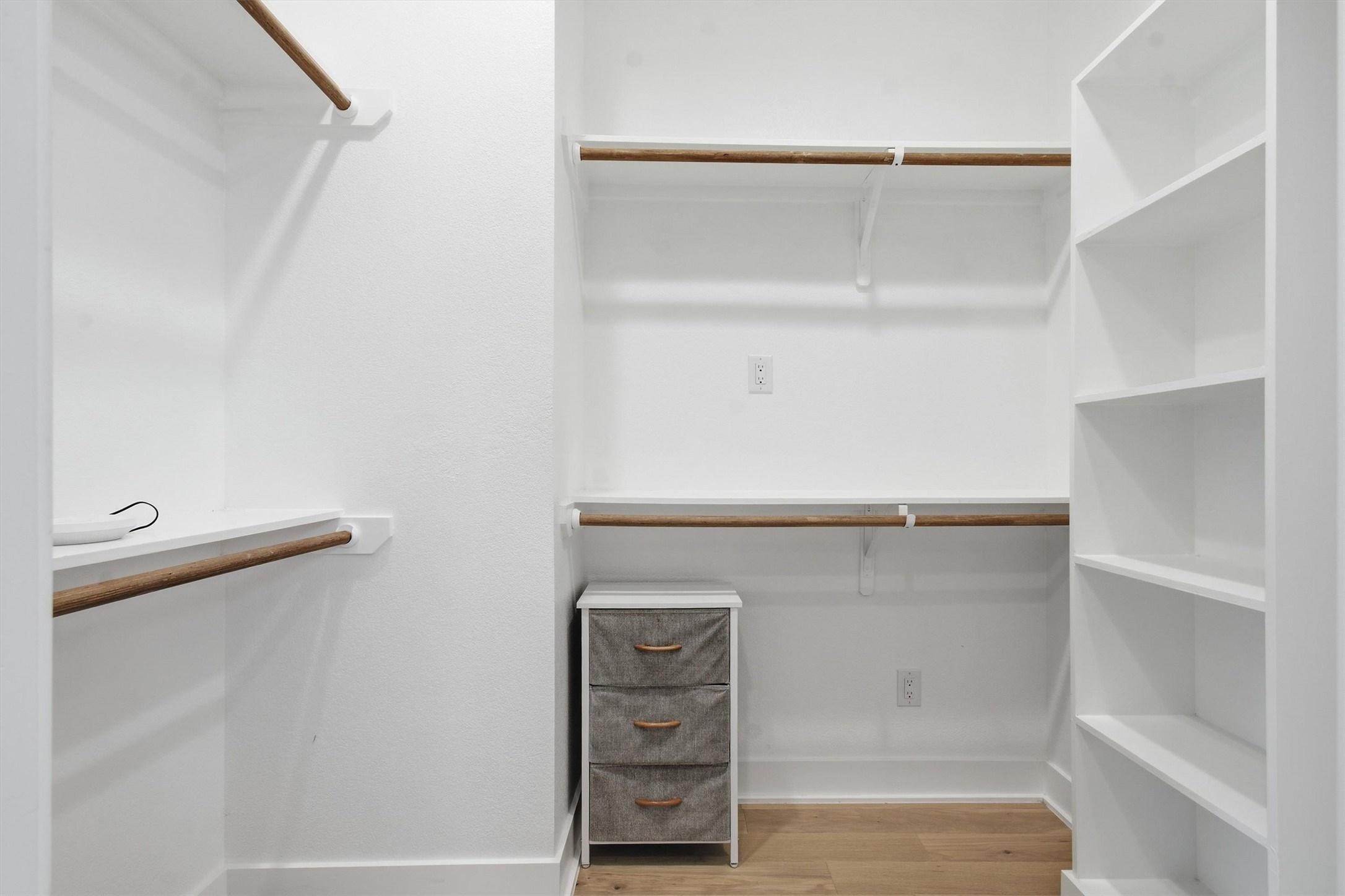 2710 Zaragosa Street, Unit A Austin, TX 78702 - Photo 19 of 29 Spacious walk-in closet with custom built-in shelving, hanging rods, and a dedicated dresser nook.