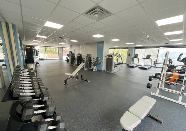 a utility room with stainless steel appliances and view of living room