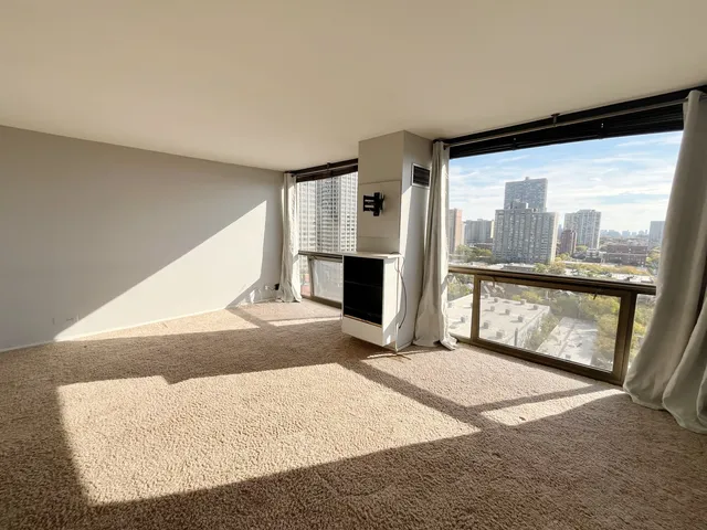 a view of a living room with a large window