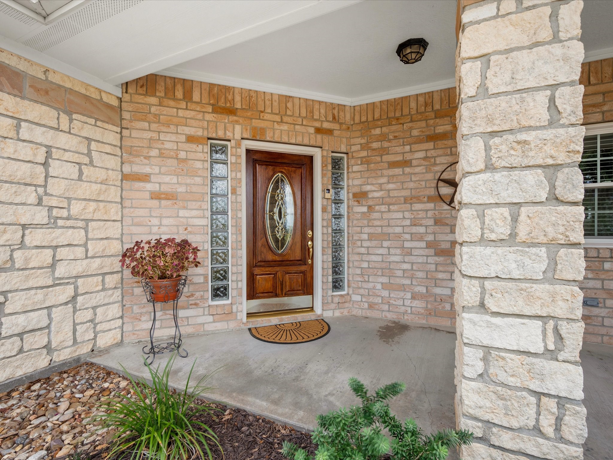 19929 Pierceall Road Hempstead, TX 77445 - Photo 12 of 50 A handsome brick and stone facade, beautiful front door, and well-maintained exterior create a warm welcome to this inviting country home.