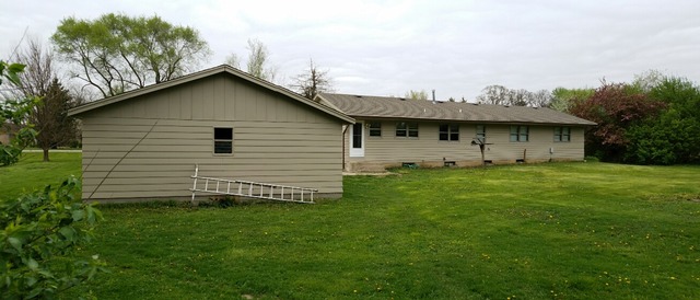 10543 East Flagg Road Rochelle, IL 61068 - Photo 14 of 17 a view of a house with a backyard