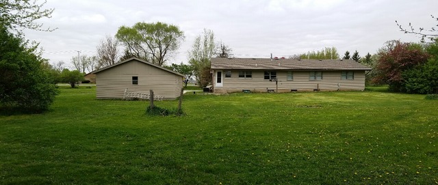 10543 East Flagg Road Rochelle, IL 61068 - Photo 16 of 17 a view of a yard in front of the house