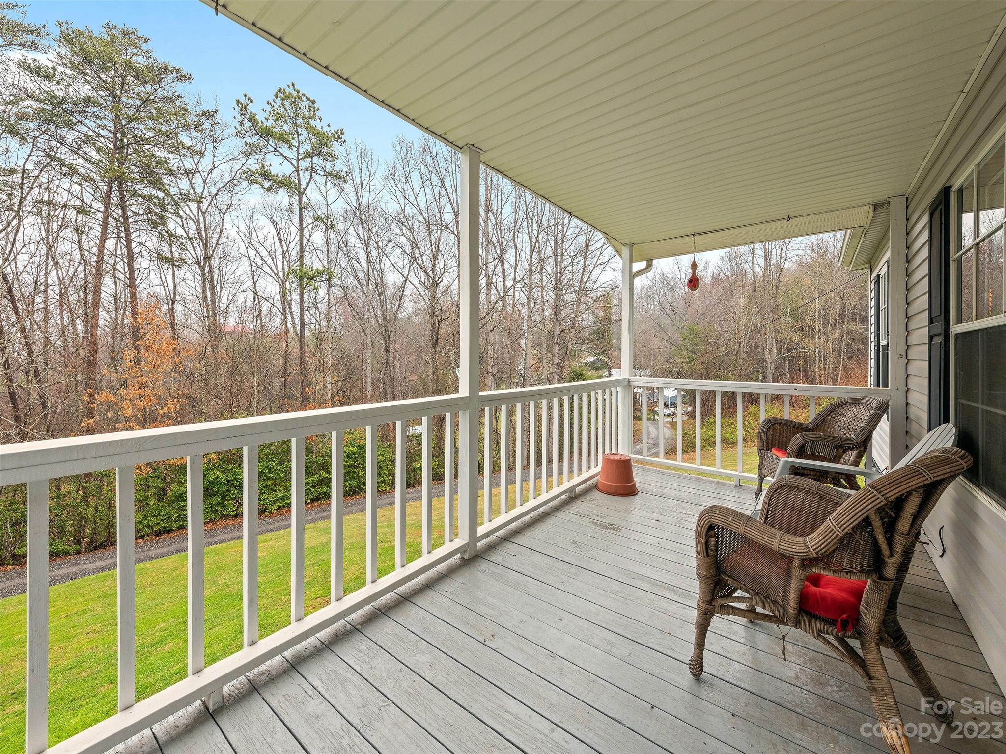1310 Chestnut Mountain Road Canton, NC 28716 - Photo 45 of 47 a view of a two chairs in the balcony